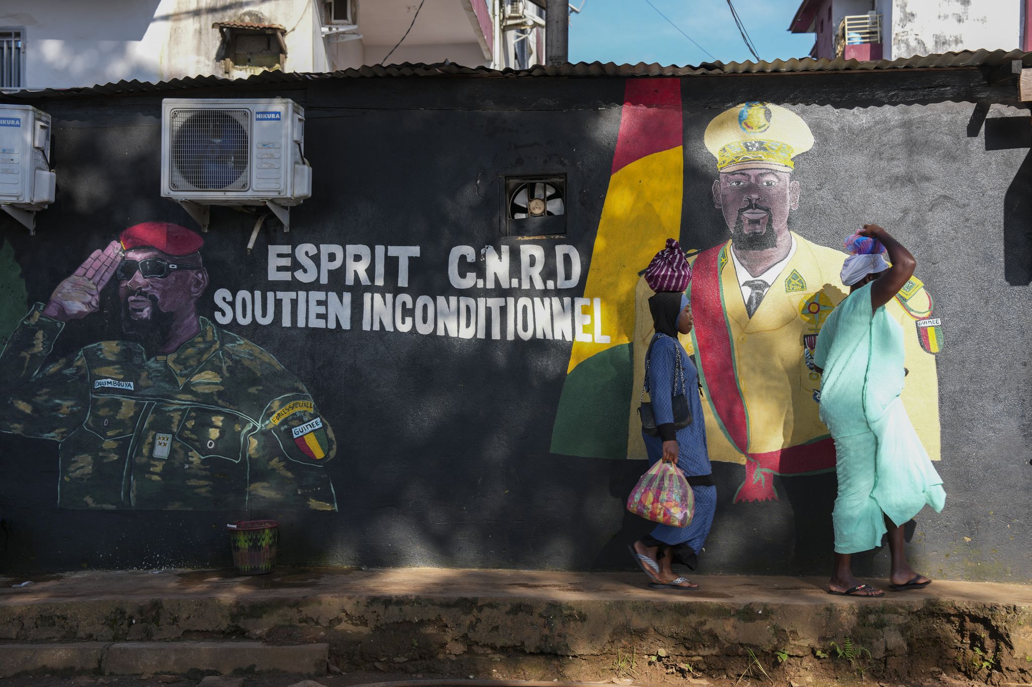 Polls open in Guinea in a referendum that could allow junta leader to run for president